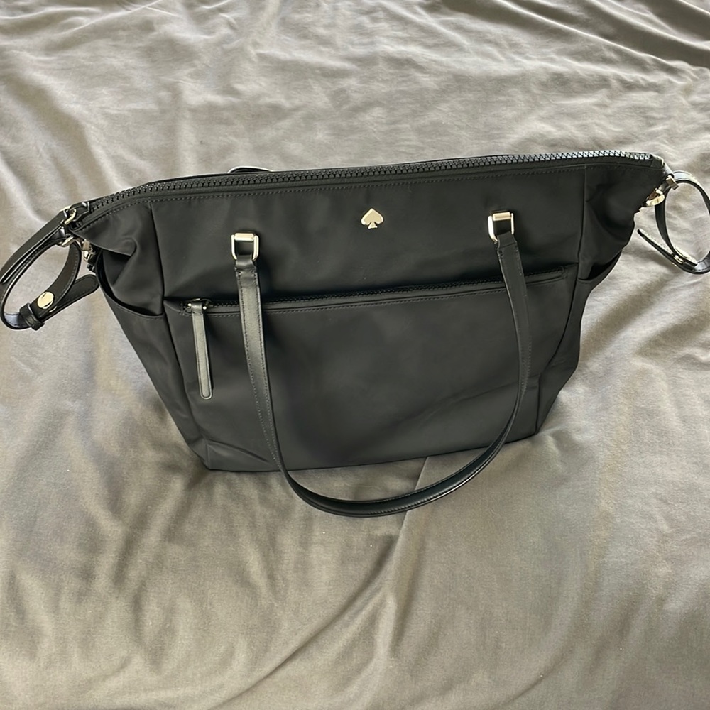 Kate Spade black diaper bag. Includes changing pad.